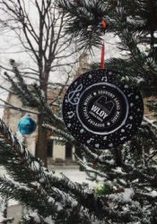 A WLOY Christmas ornament made out of a CD with the WLOY 'support local music logo'.